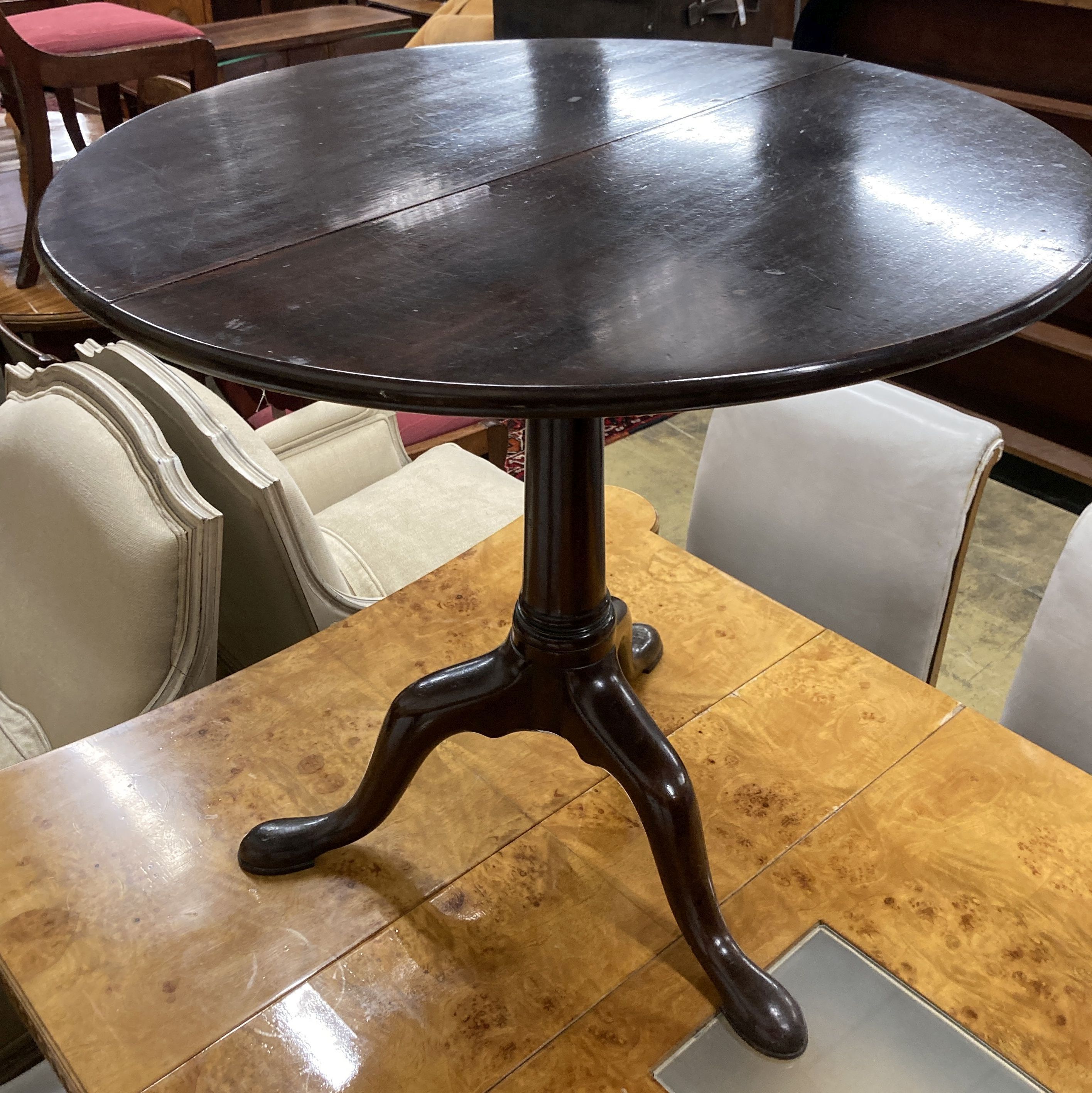 A George III circular mahogany tilt top birdcage tea table, 76cm diameter, 69cm high